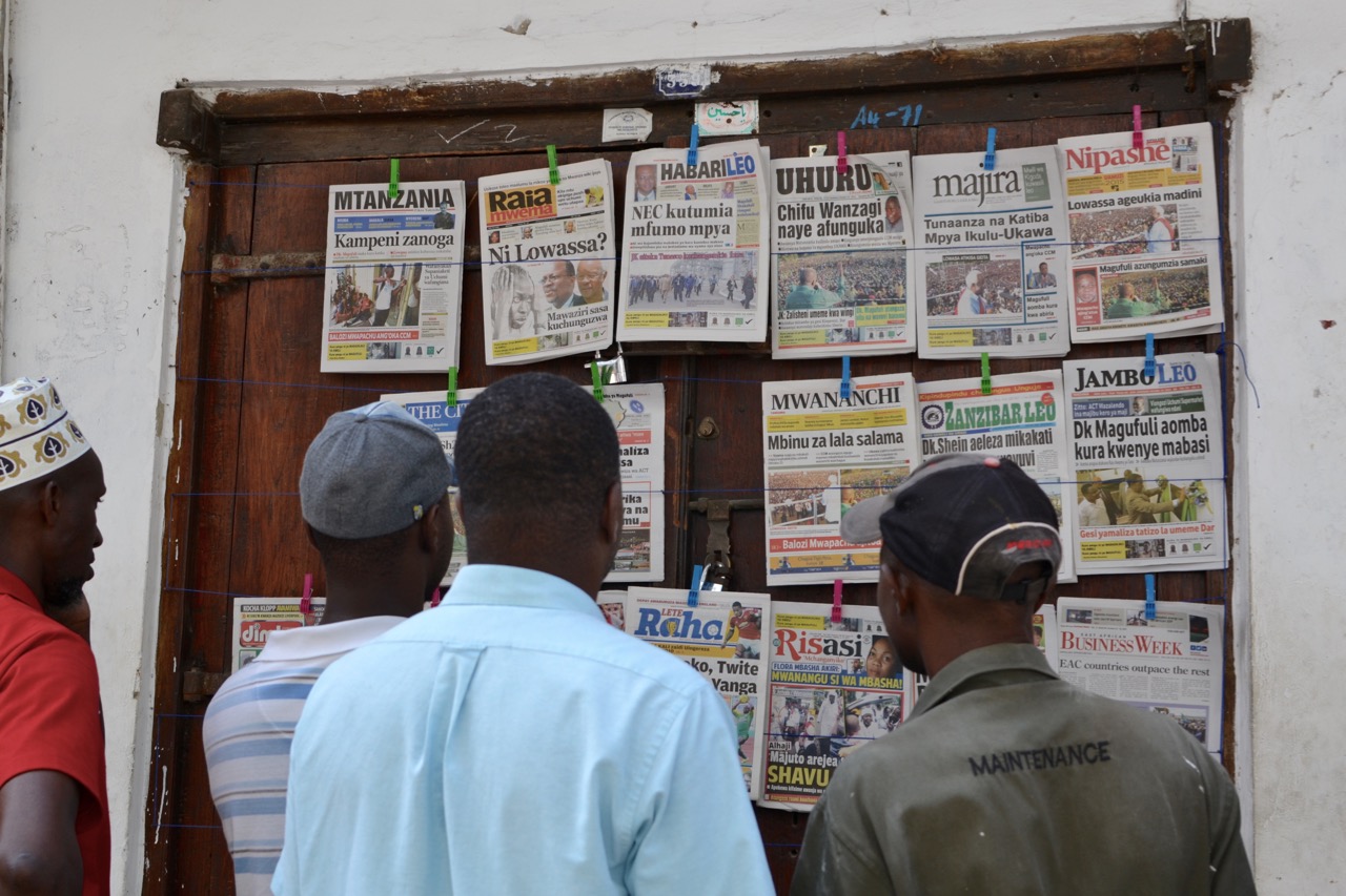 Men in Stone Town, Zanzibar read headlines on Oct 14, 2015, about 10 days before the election